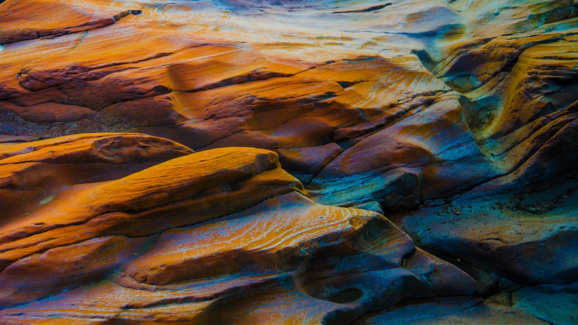 Brightly coloured rock on a beach in Maryport, Cumbria, England, UK