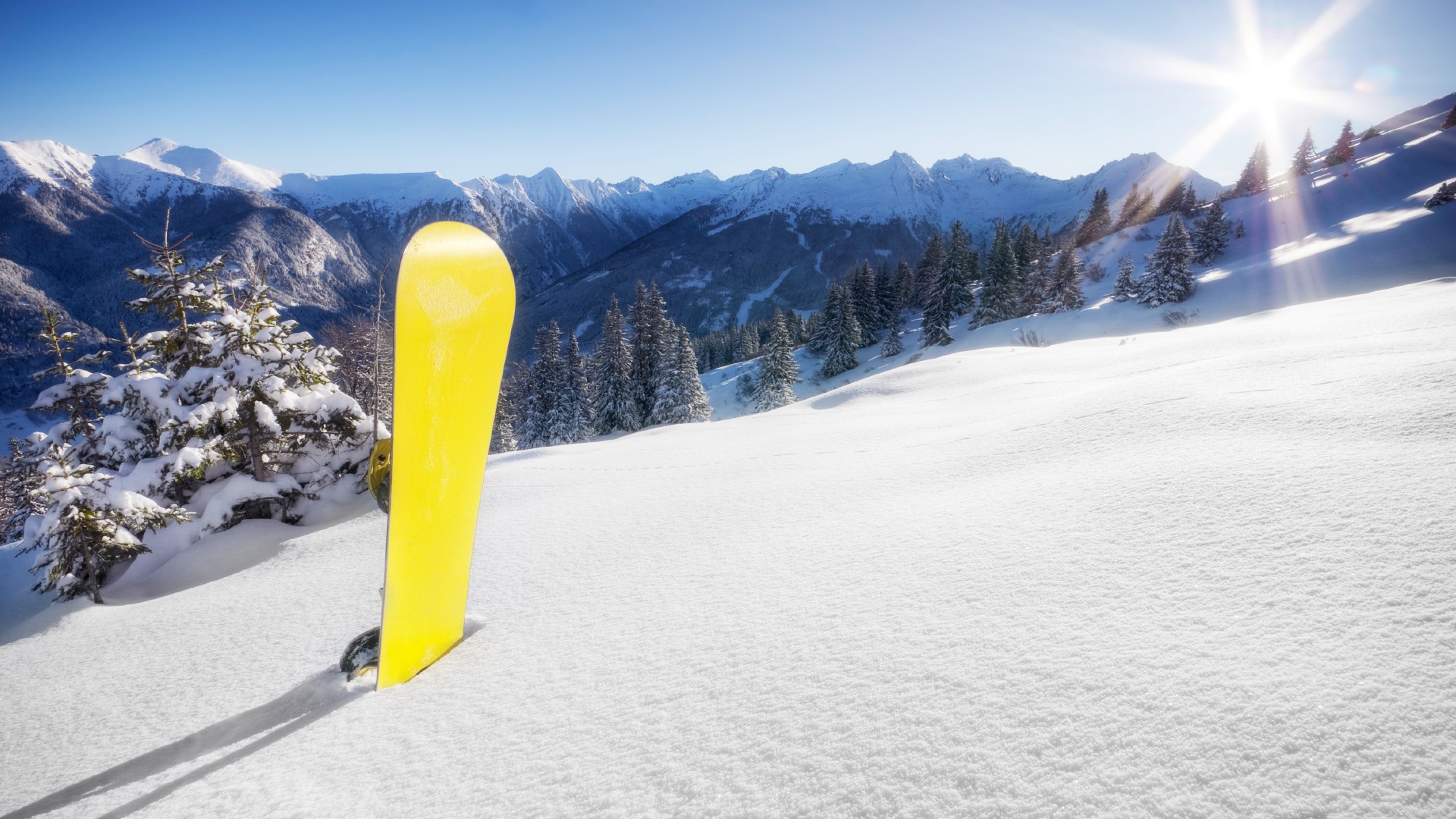 Powder snow and snowboard on a sunny day in the Alps, Bad Gastein, Austria