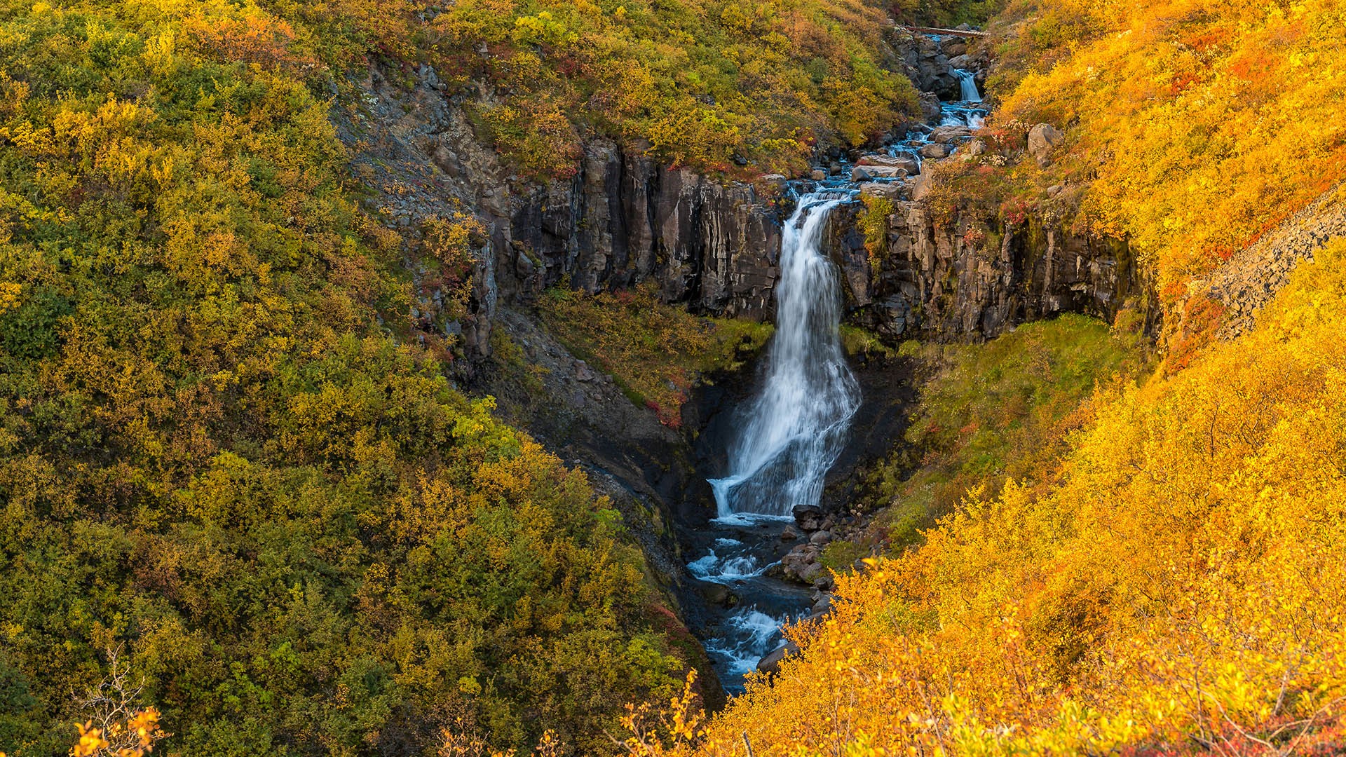 Waterfall in Skaftafell national park surrounded by heart-shaped space, Iceland