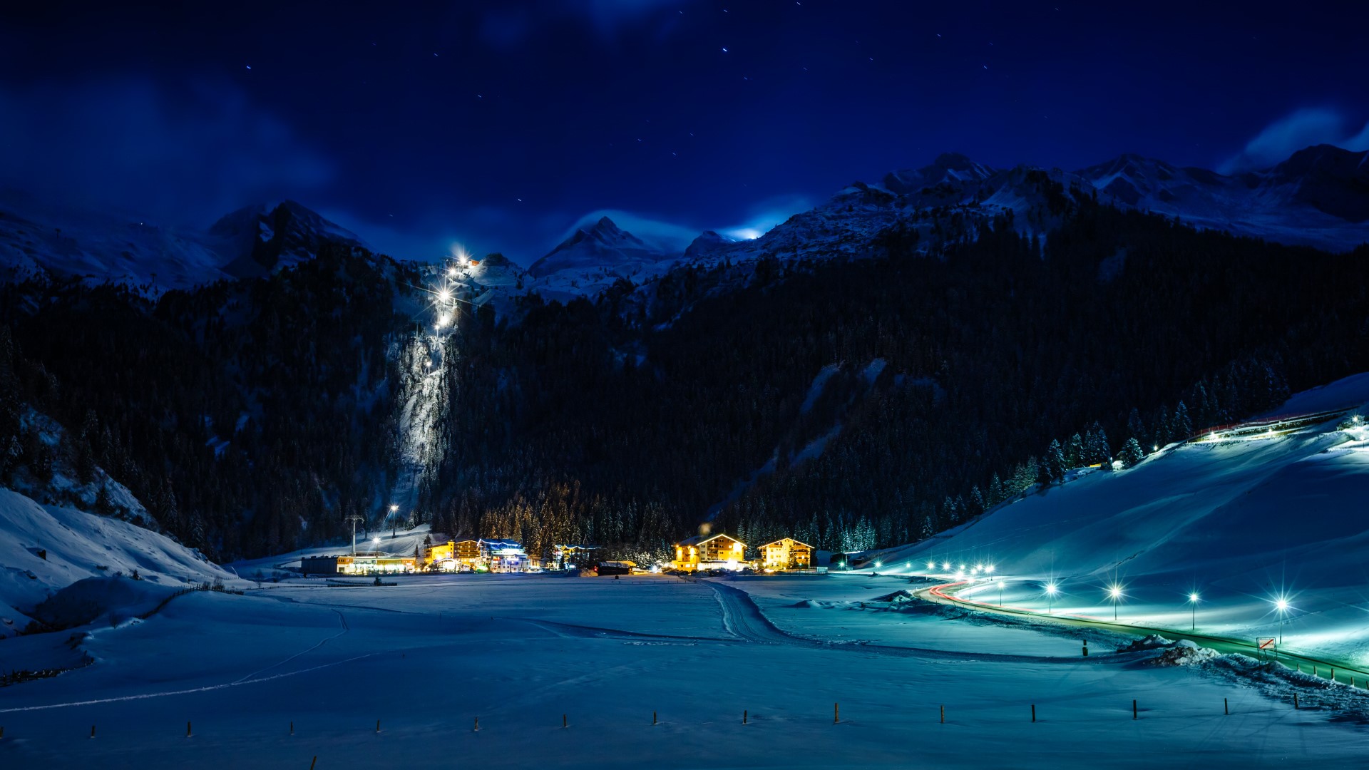 Winter ski resort Hintertux in night lit by moon, Tirol, Austria