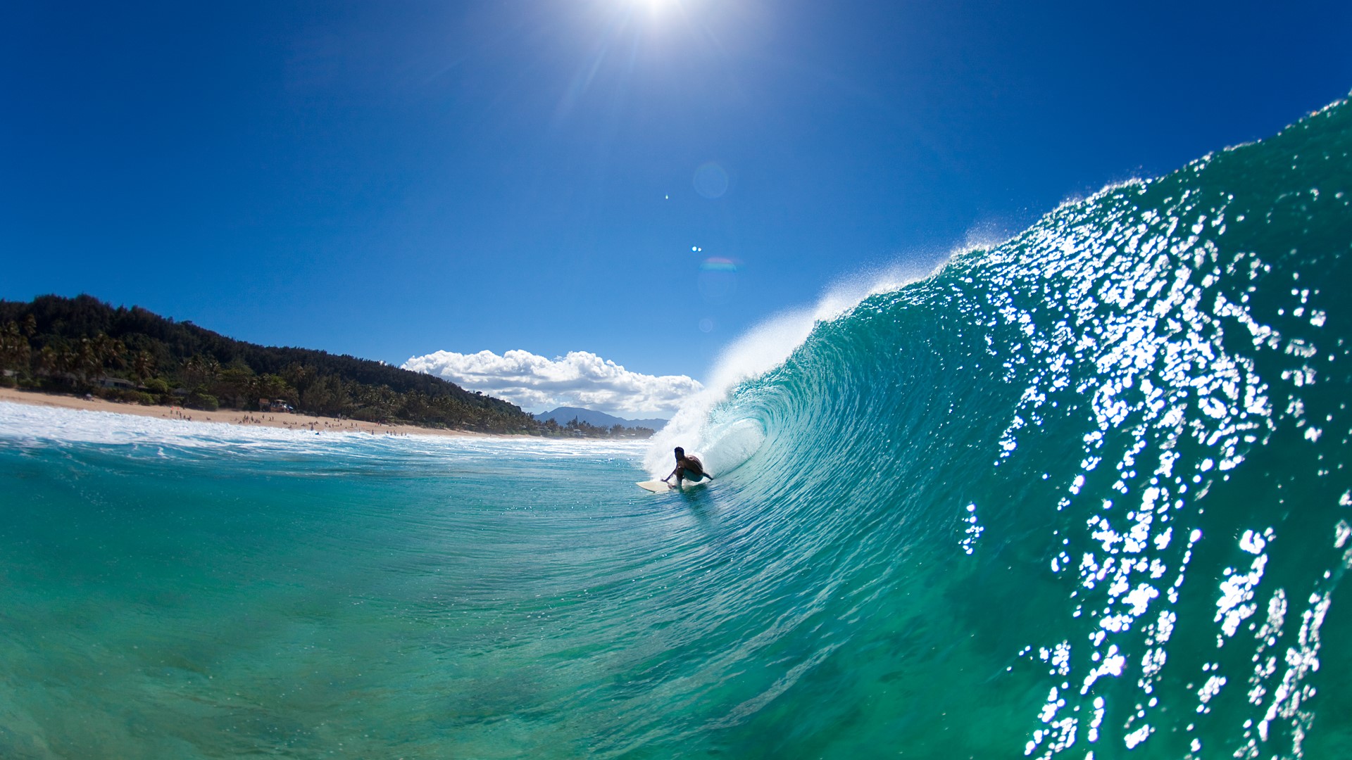Water view of a surfer getting barreled at Pūpūkea Sandbar, Oahu, Hawaii, USA