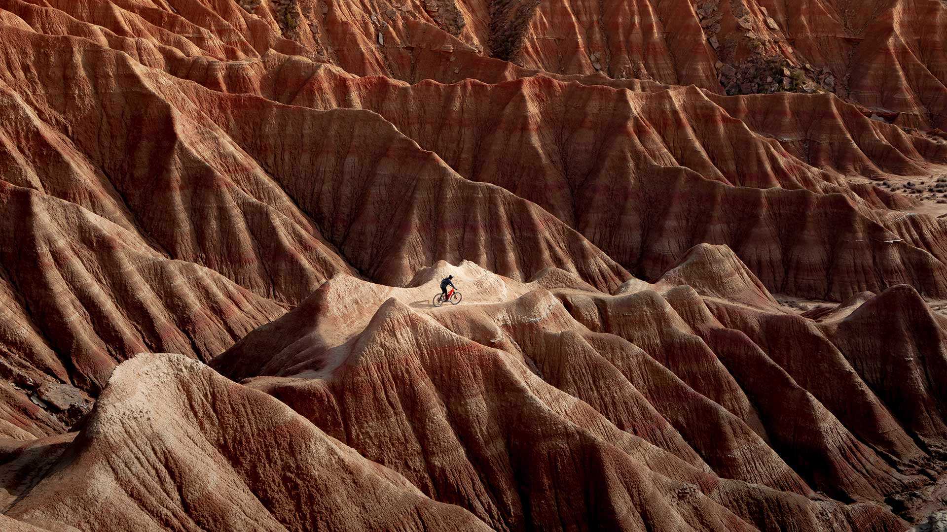 Cyclist in Bardenas Reales Natural Park and Biosphere Reserve, Navarra, Spain
