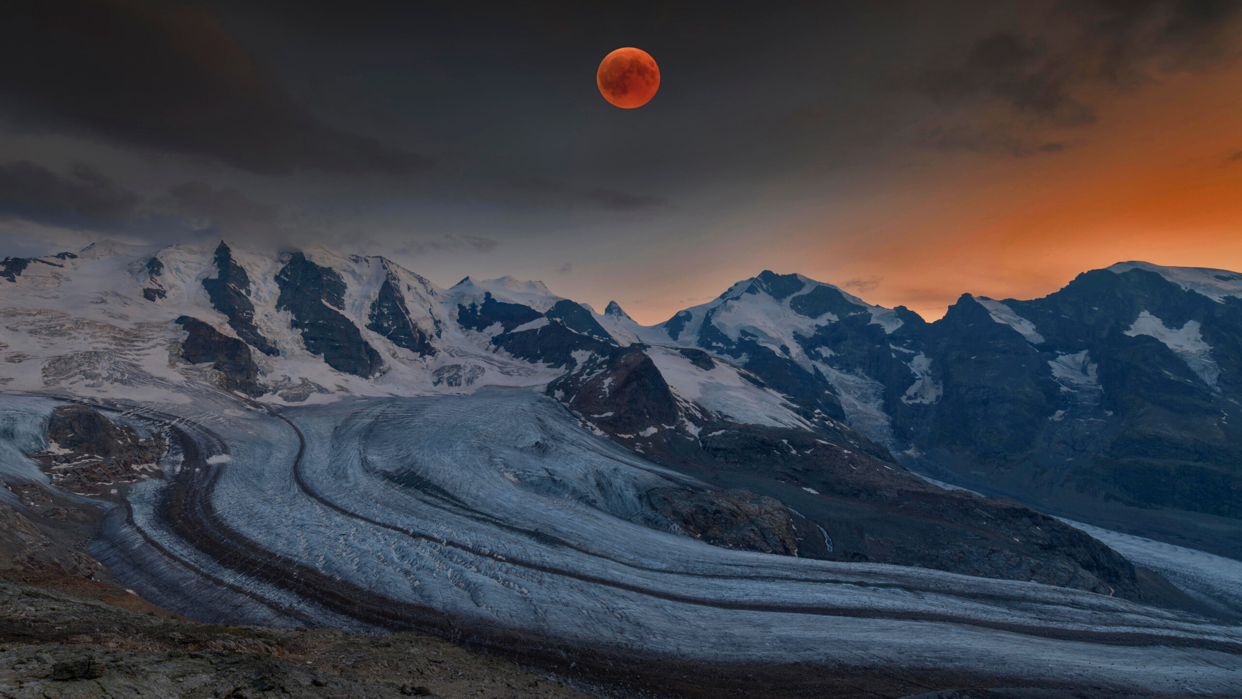 Panoramic view of the Bernina Range with blood moon, Eastern Alps, Engadin, Switzerland