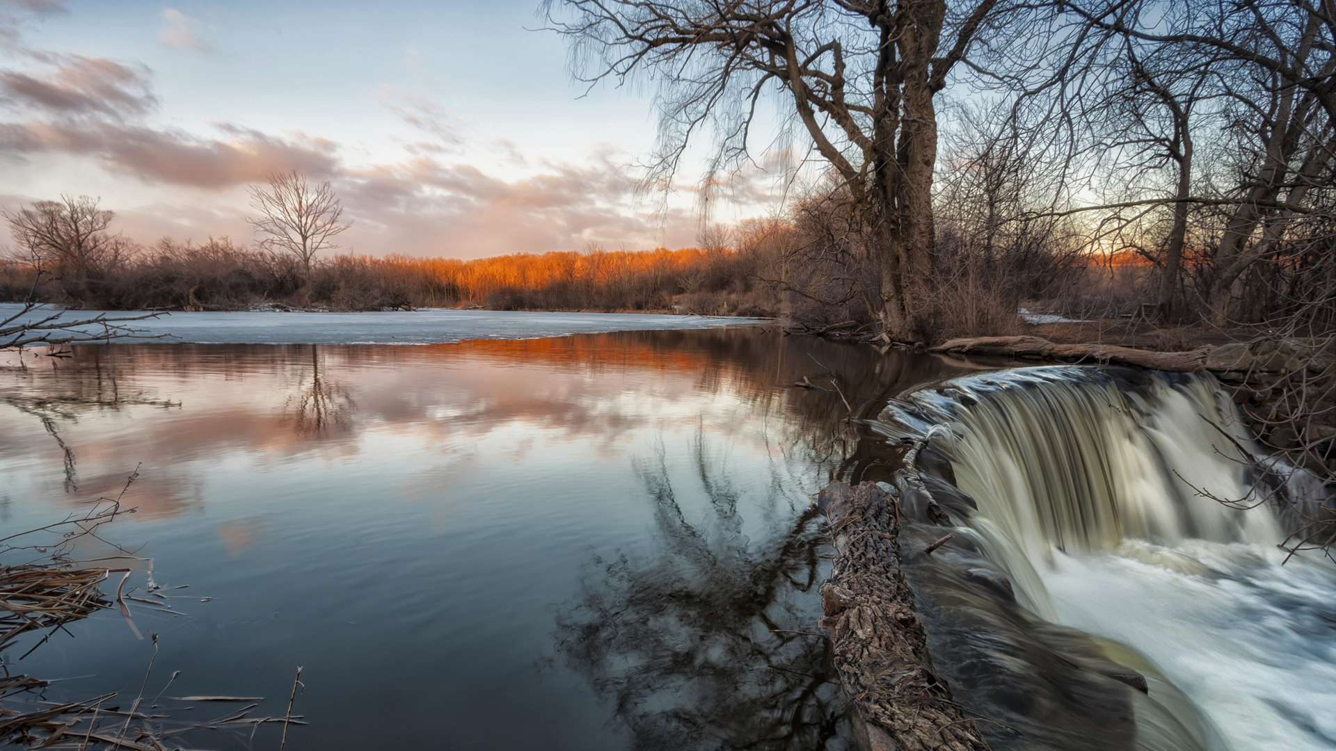 Waterfall flows strong due to melting snow and ice, Franklin, Wisconsin, USA