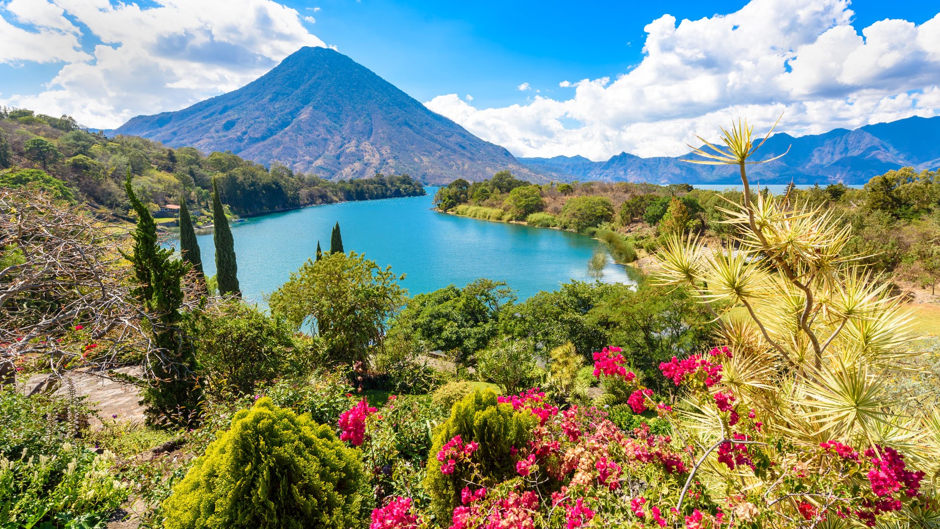 Bay of Lake Atitlán with view to Volcano San Pedro in highlands of Guatemala