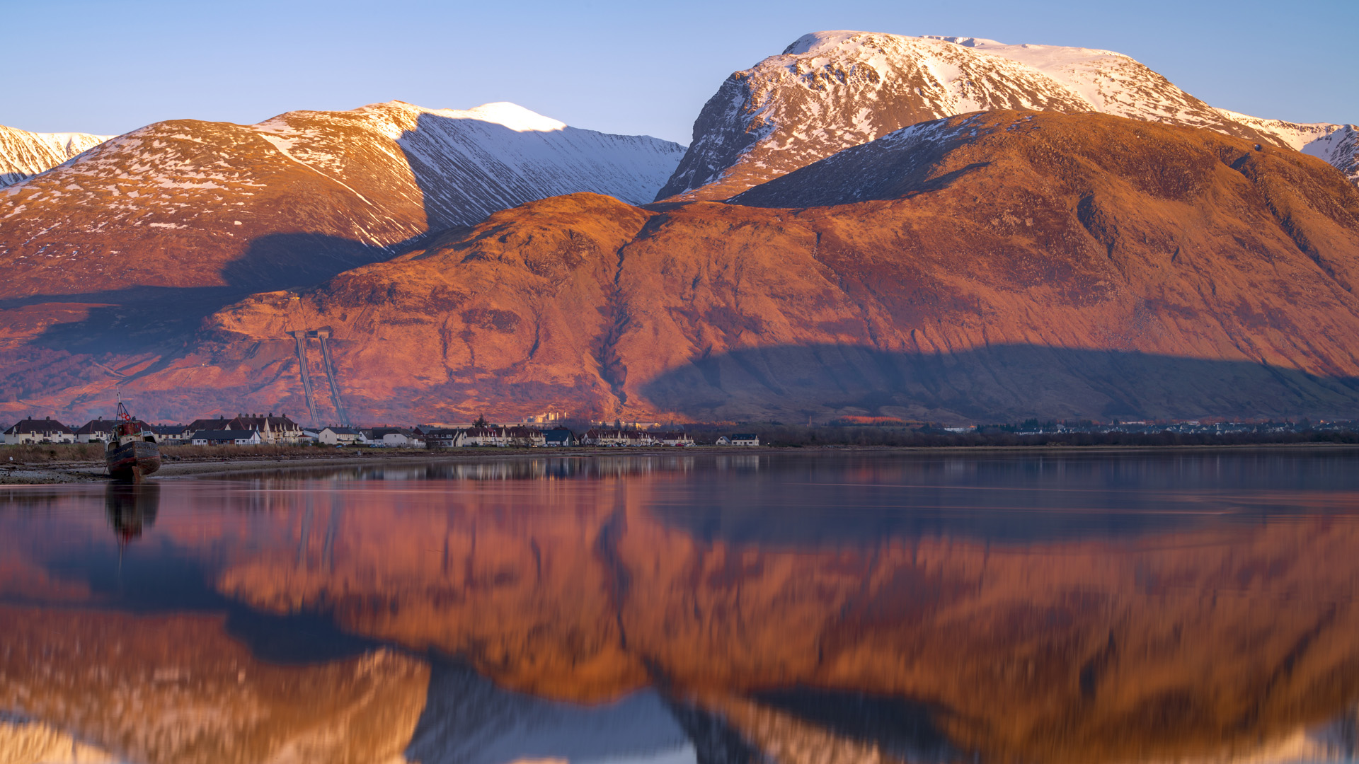 Sunset light on Ben Nevis mountain with Loch Eilch, Scotland, UK