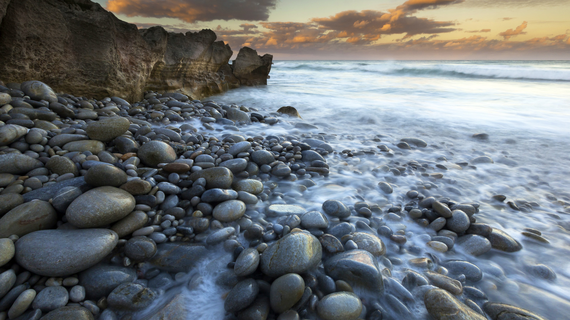 The coastline, bays and cliffs on Cape Agulhas near Arniston at sunset, South Africa