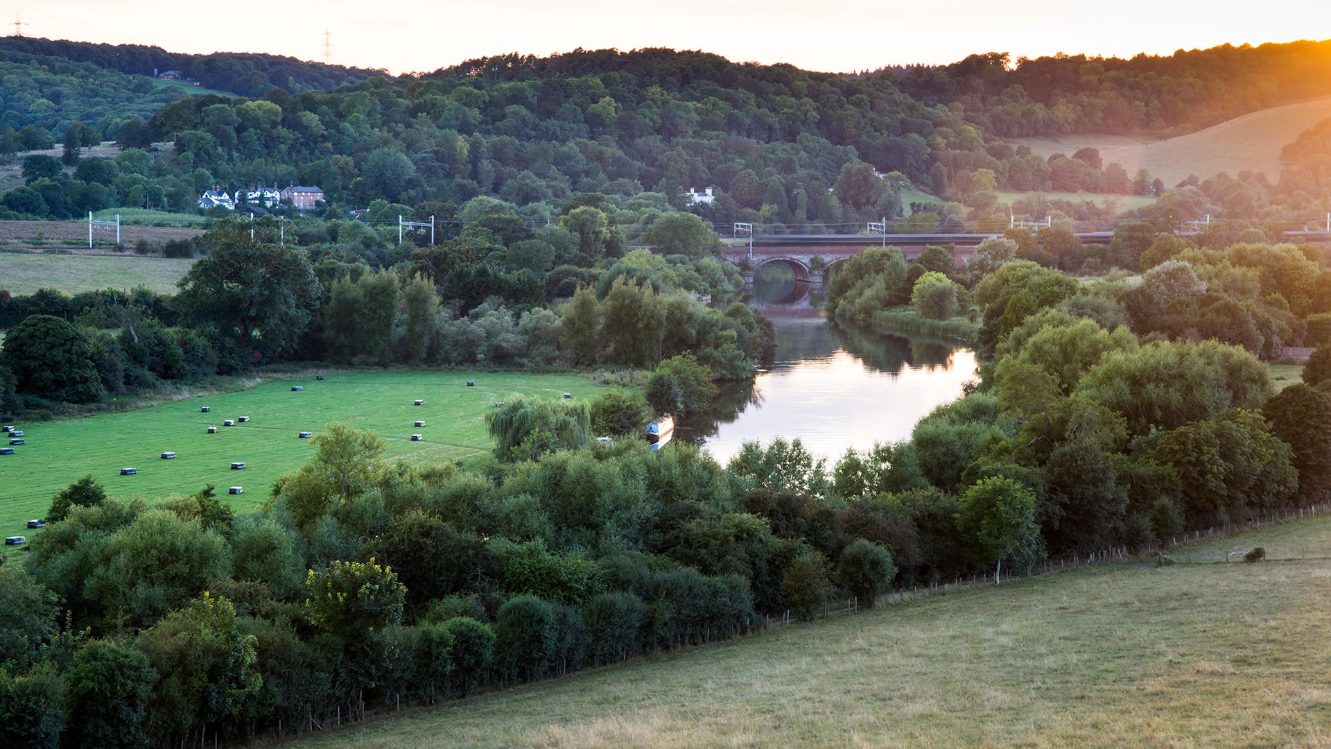 Turbo diesel multiple units crossing the River Thames at Goring Gap, Berkshire, England, UK