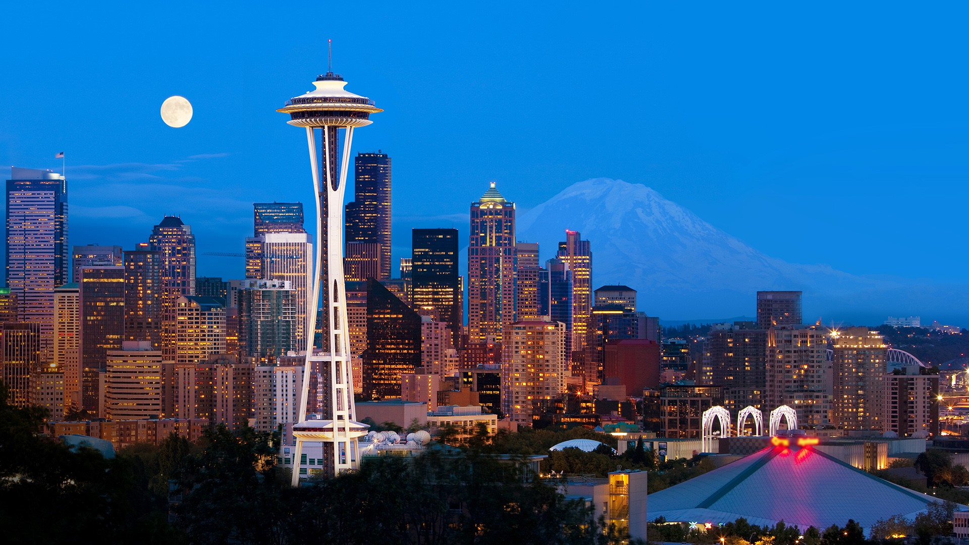 Downtown Seattle skyline and Space Needle at night with full moon, Washington State, USA